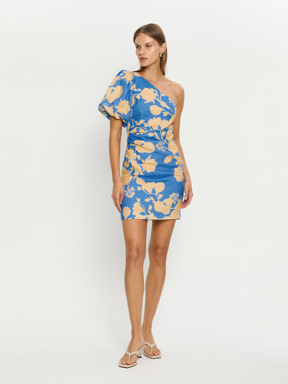 Aurora Mini Dress KIVARI | Model wears blue floral mini dress side view