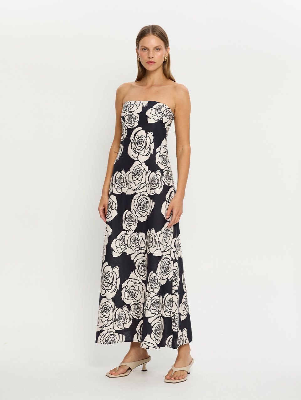 Carmen Strapless Maxi Dress KIVARI | Model wears navy and white floral strapless maxi dress side view