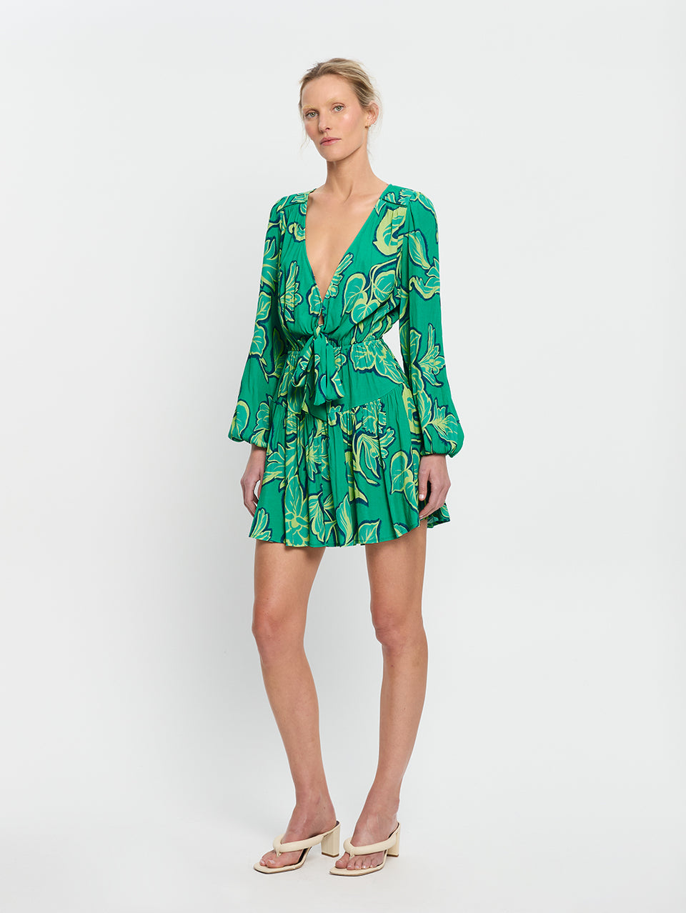 Fiora Tie Front Mini Dress KIVARI | Model wears green floral tie front mini dress side view