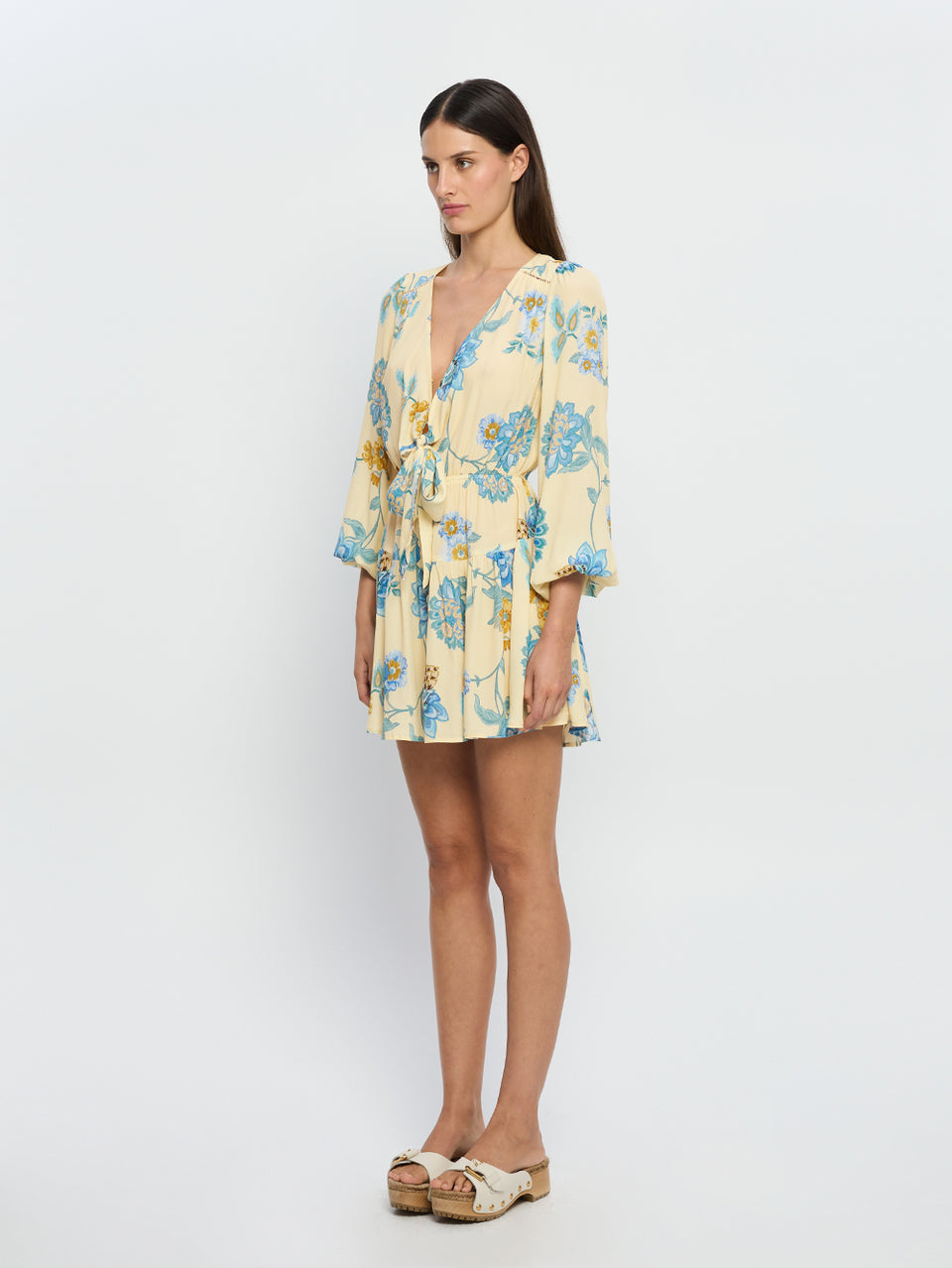 Giselle Tie Front Mini Dress KIVARI | Model wears blue and yellow tie front mini dress side view