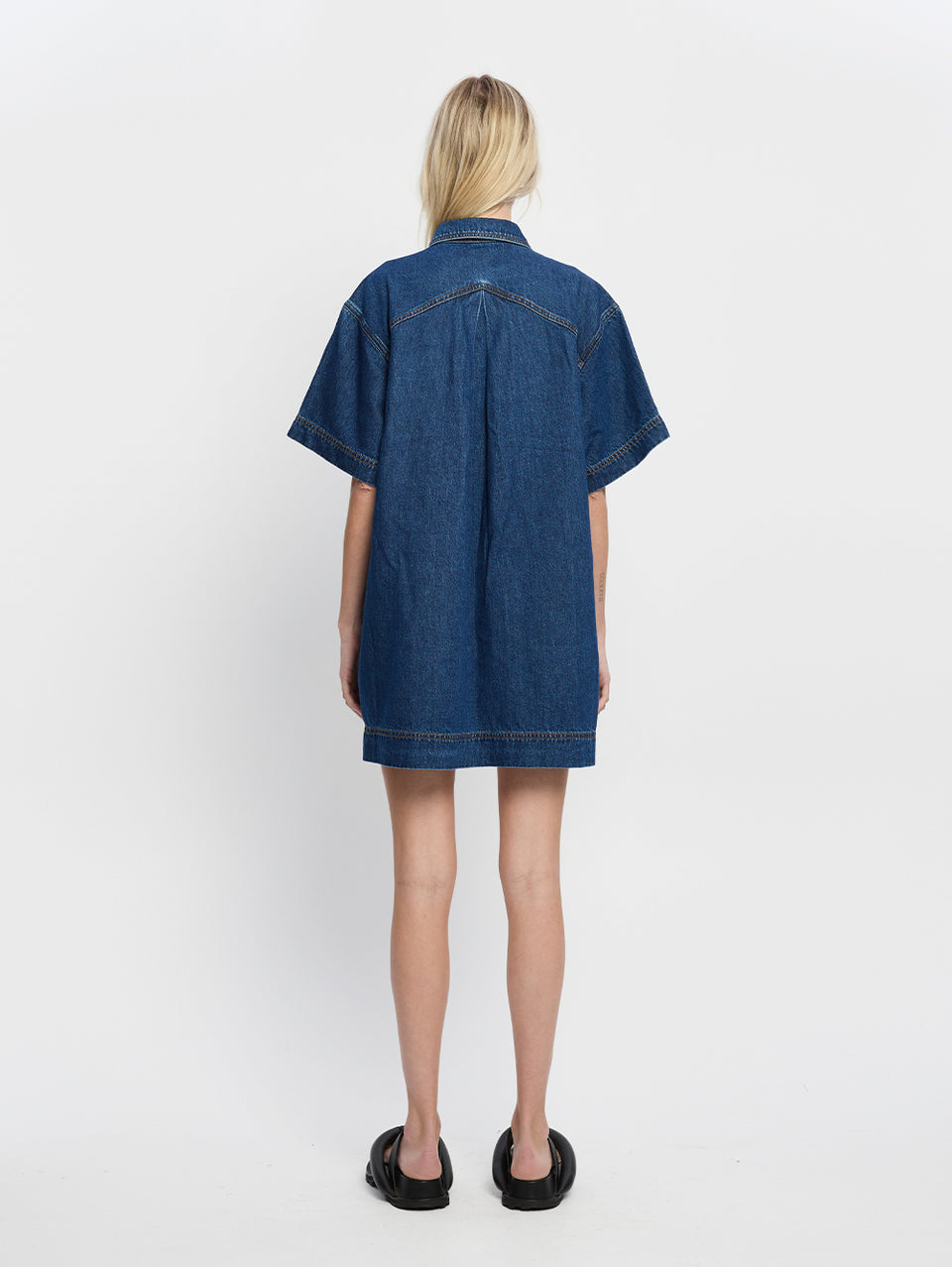 Jada Mini Dress KIVAIR | Model wears denim mini dress back view