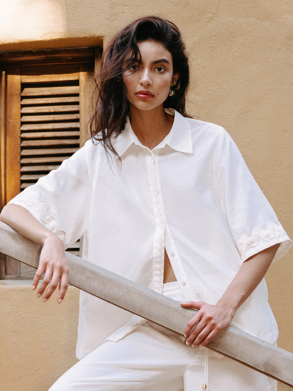 Woman in white linen shirt