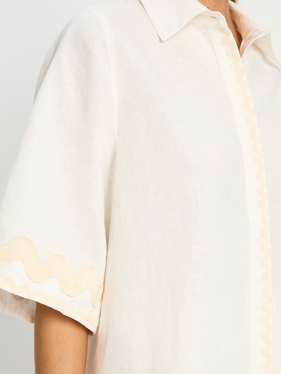 Woman in white linen shirt