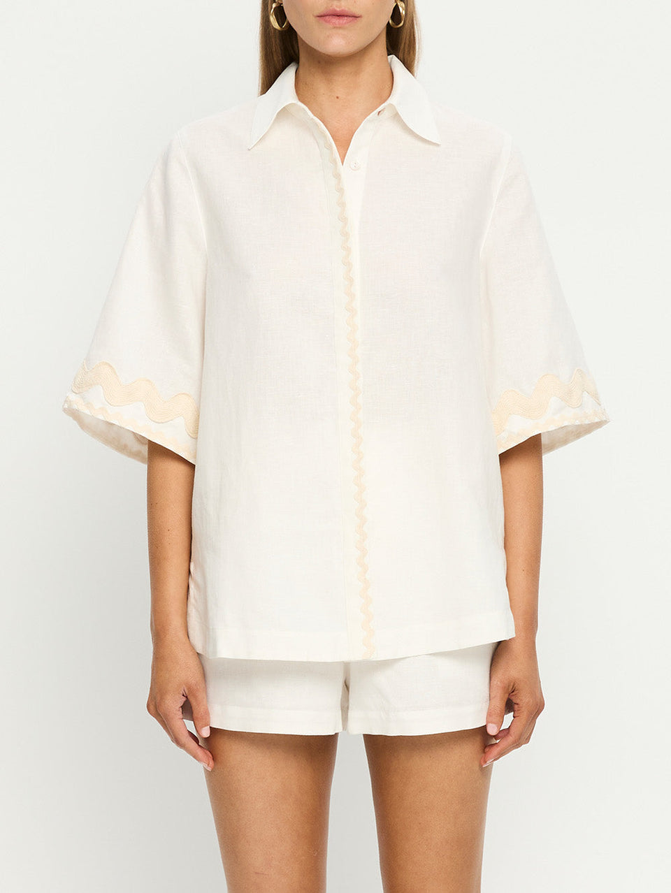 Woman in white linen shirt