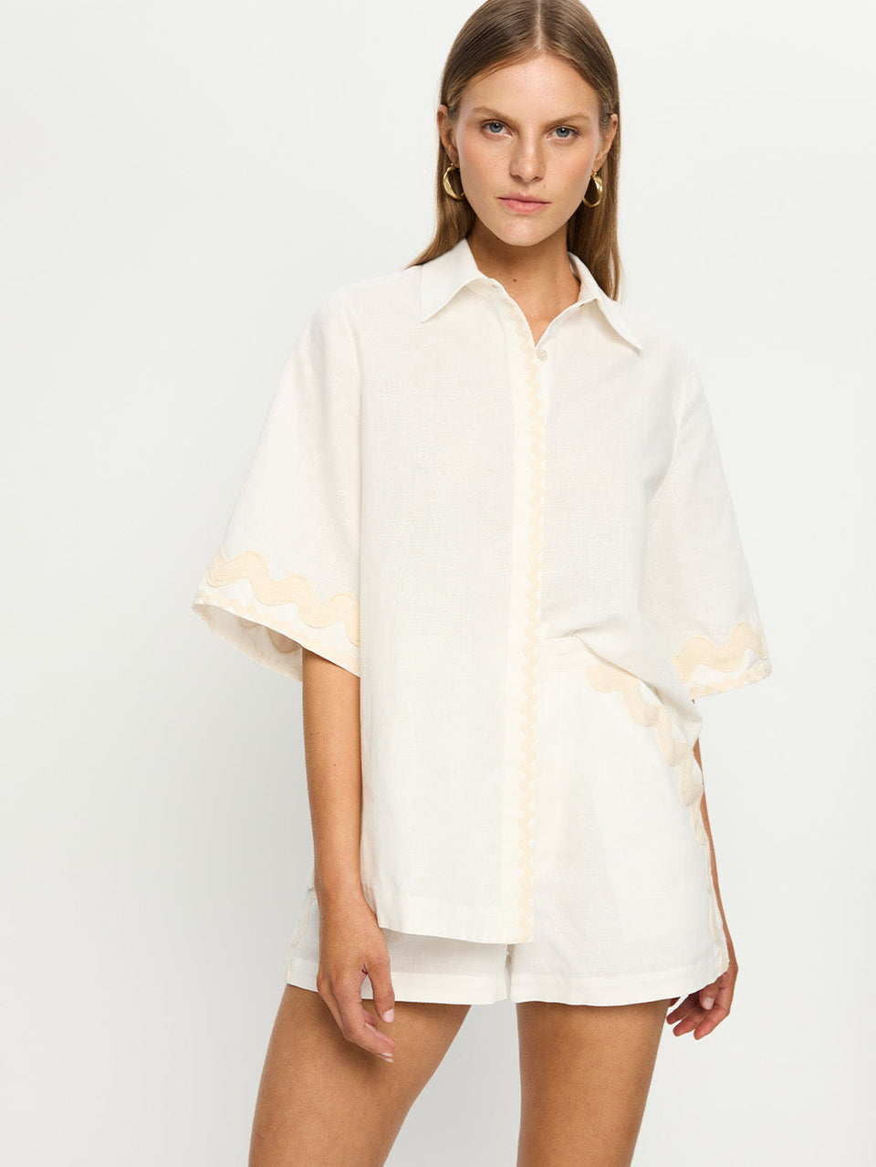 Woman in white linen shirt