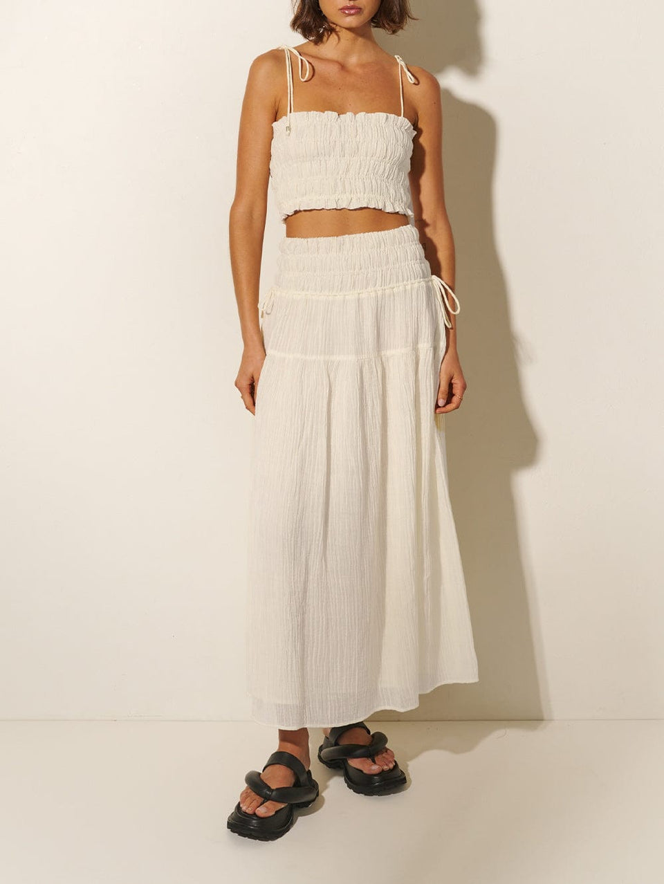 Nora Maxi Skirt KIVARI | Model wears ivory maxi skirt with matching crop top