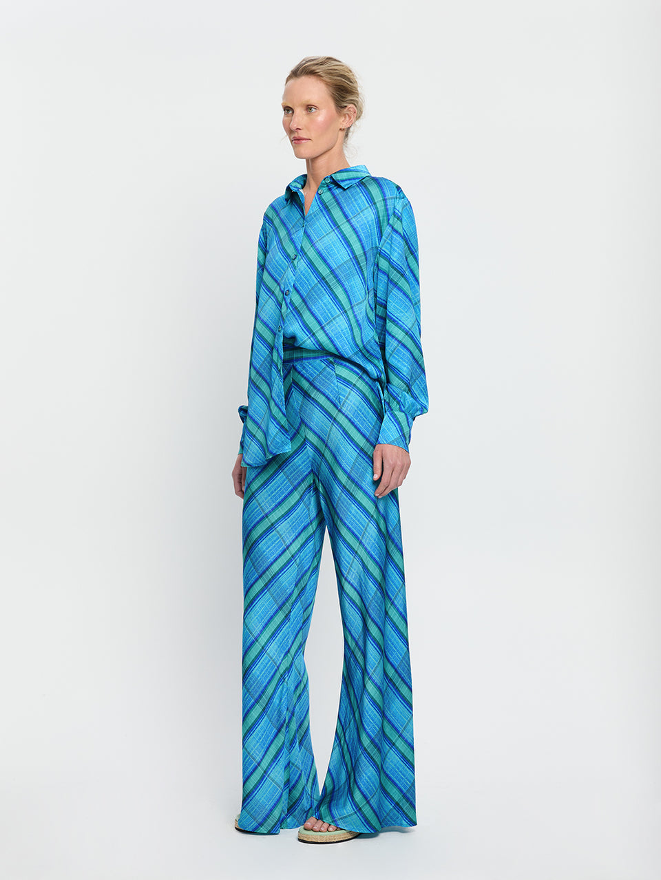 Oceana Bias Pant KIVARI | Model wears blue check print bias cut pant side view