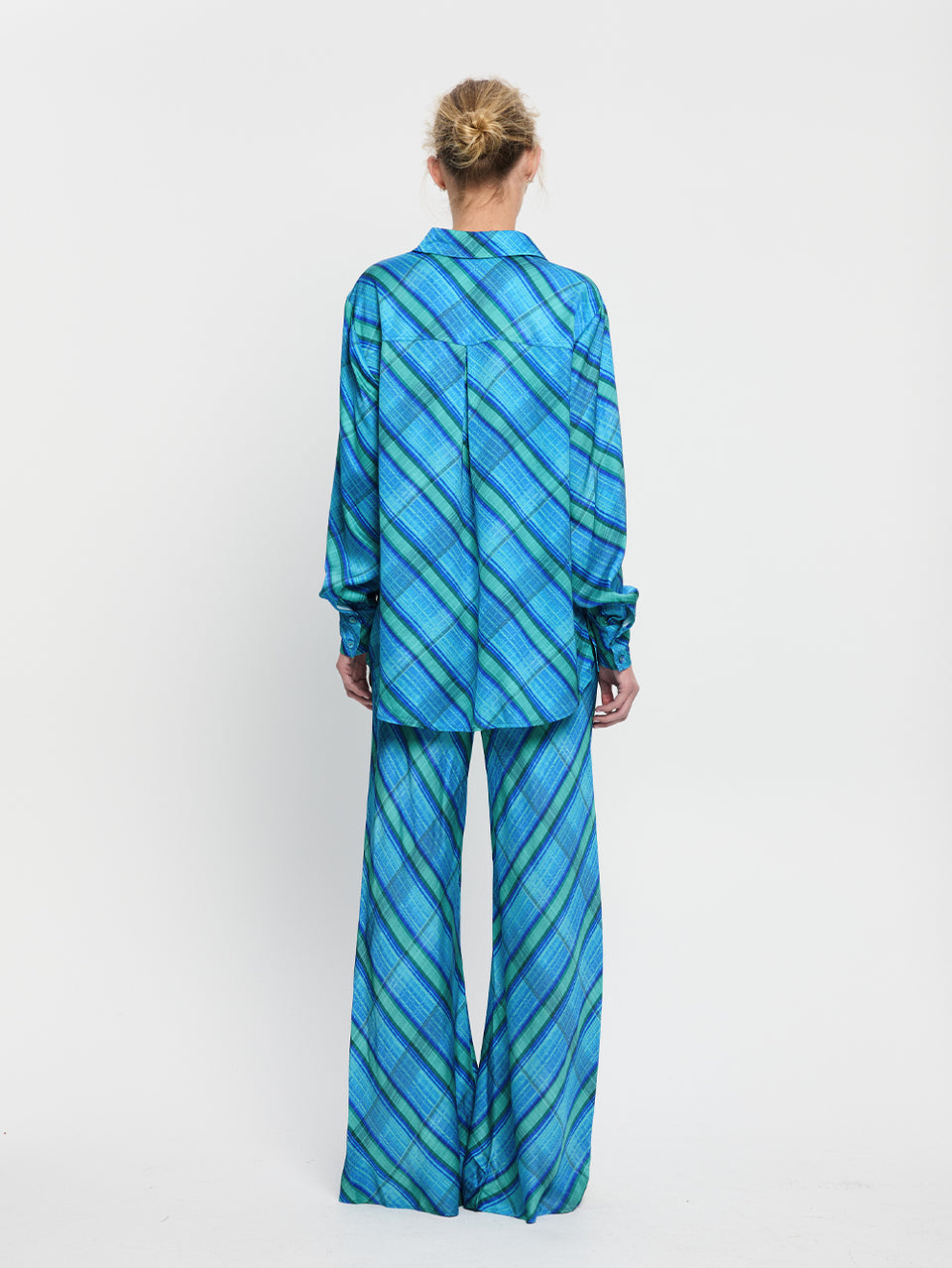 Oceana Bias Pant KIVARI | Model wears blue check print bias cut pant back view