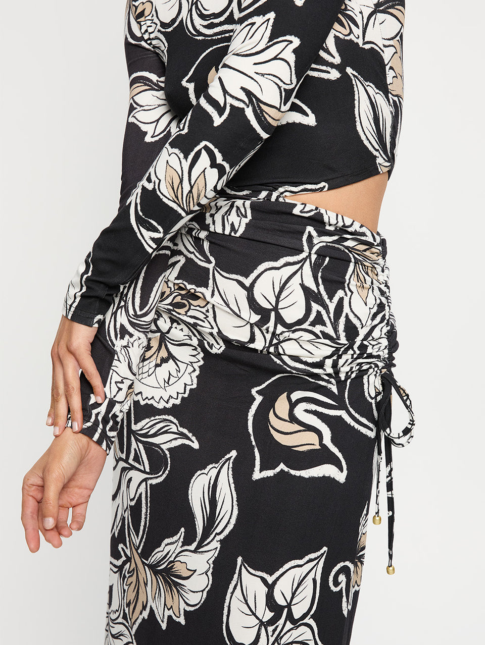 Alma Knit Maxi Dress KIVARI | Model wears black and white floral maxi dress