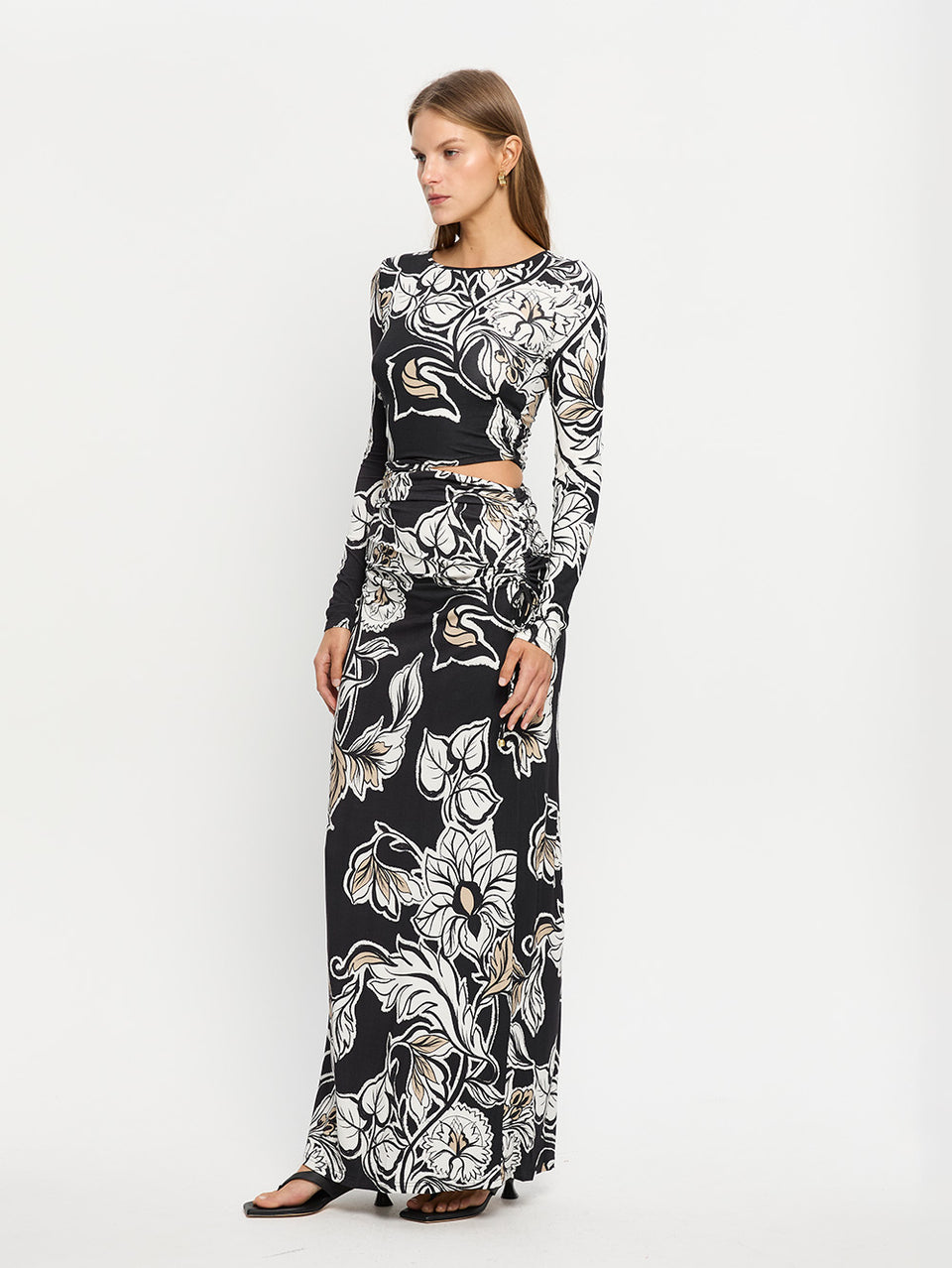 Alma Knit Maxi Dress KIVARI | Model wears black and white floral maxi dress
