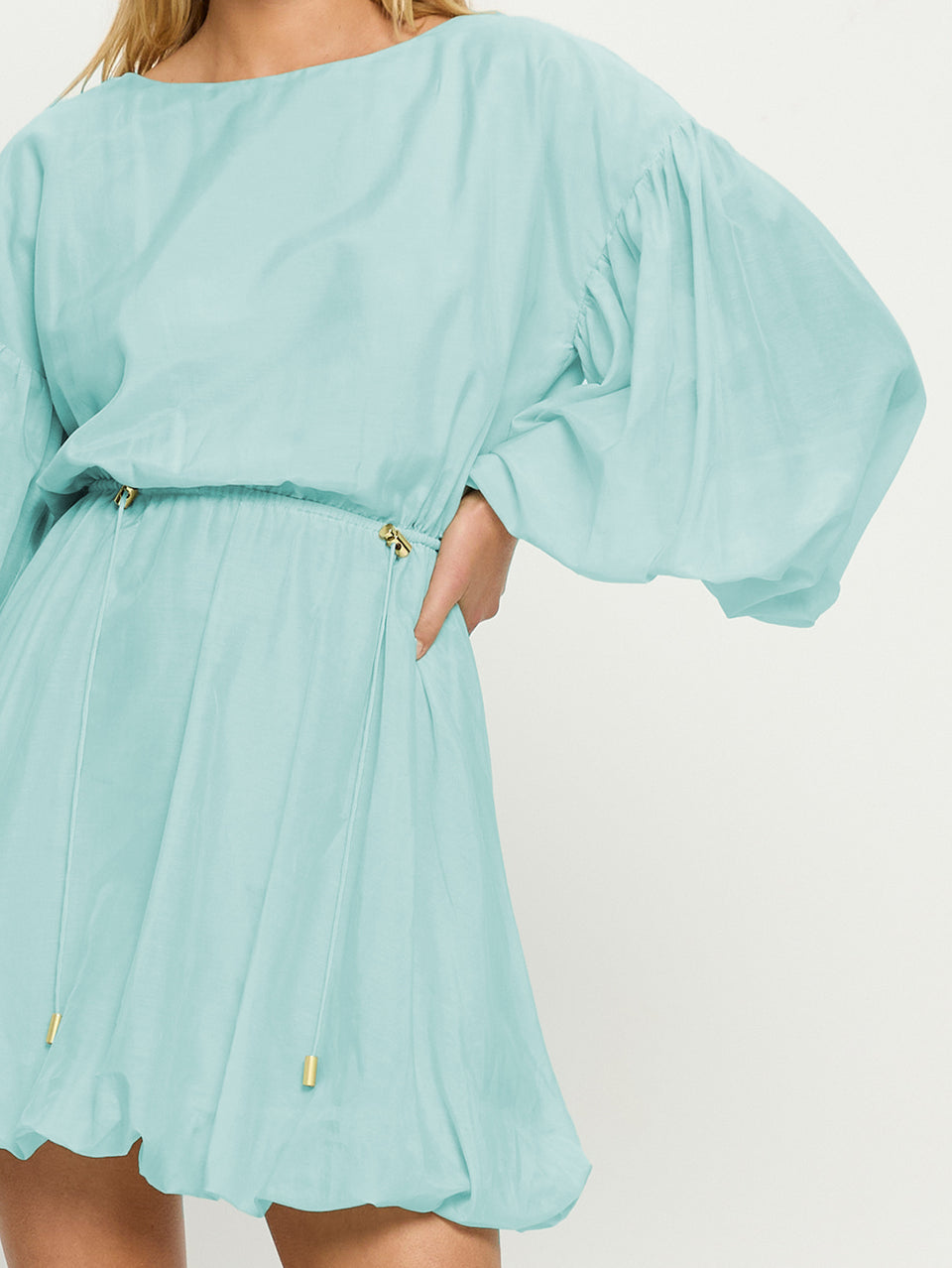 Light blue dress with puff sleeves on a white background