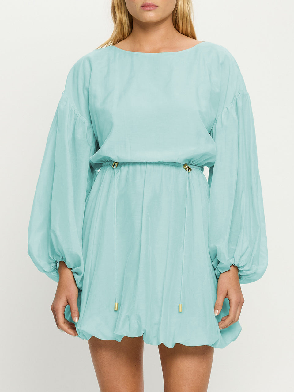 Light blue dress with long sleeves on a white background