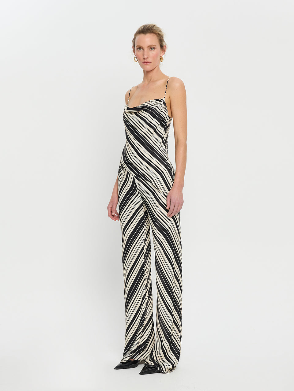 Sara Top KIVARI | Model wears asymmetrical stripe top side view