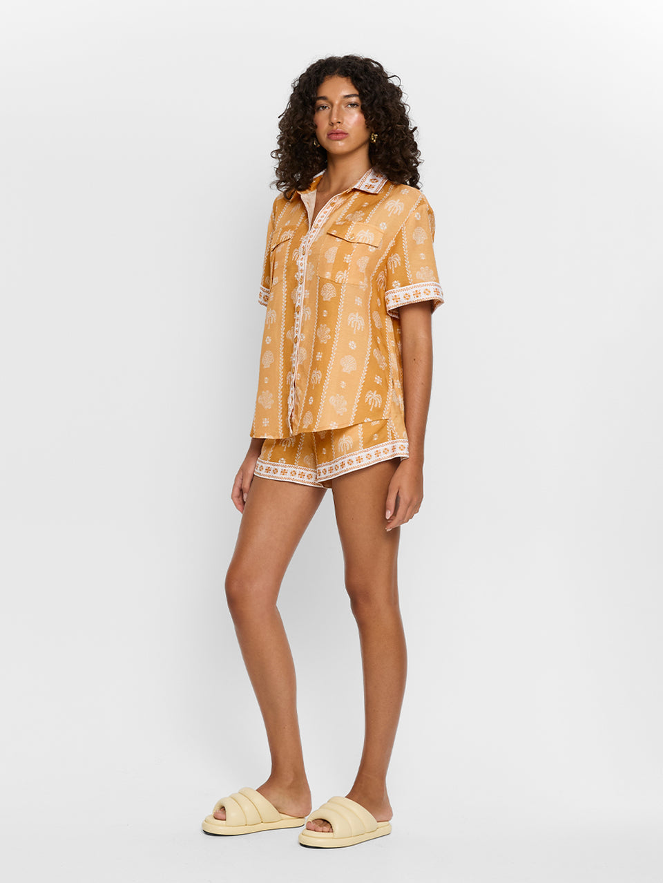 Sienna Shirt KIVARI | Model wears orange print shirt side view