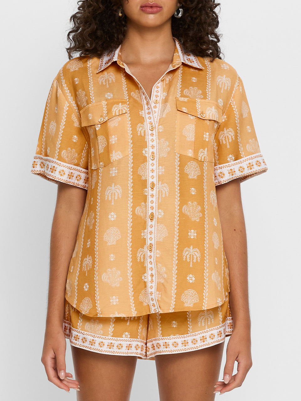 Sienna Shirt KIVARI | Model wears orange print shirt