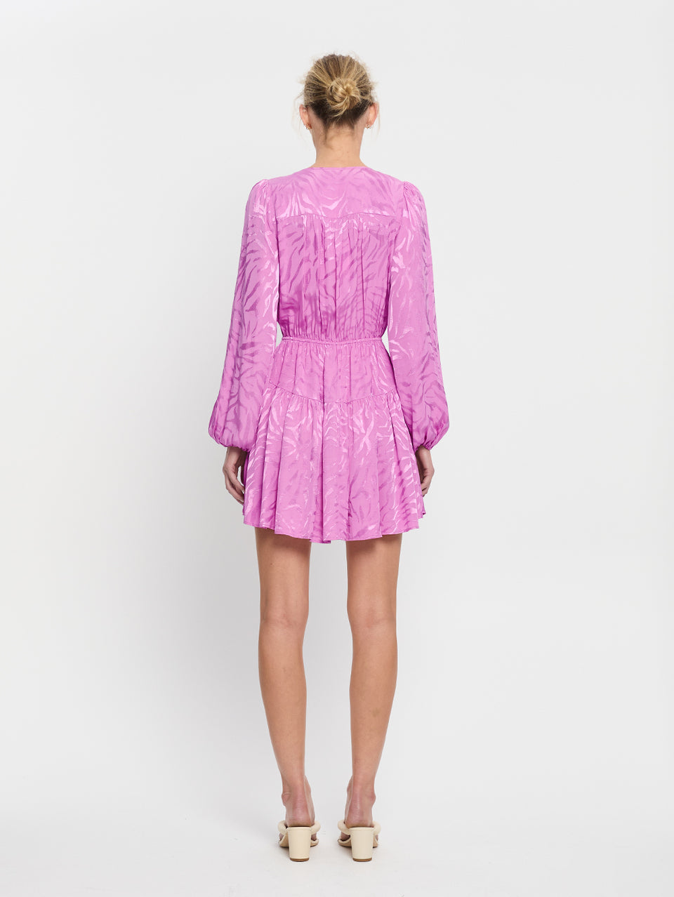 Stela Tie Front Mini Dress KIVARI | Model wears pink zebra print mini dress back view