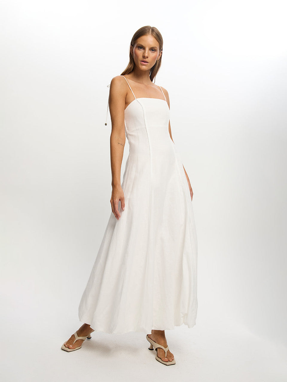 Woman in White Long Dress on Beach