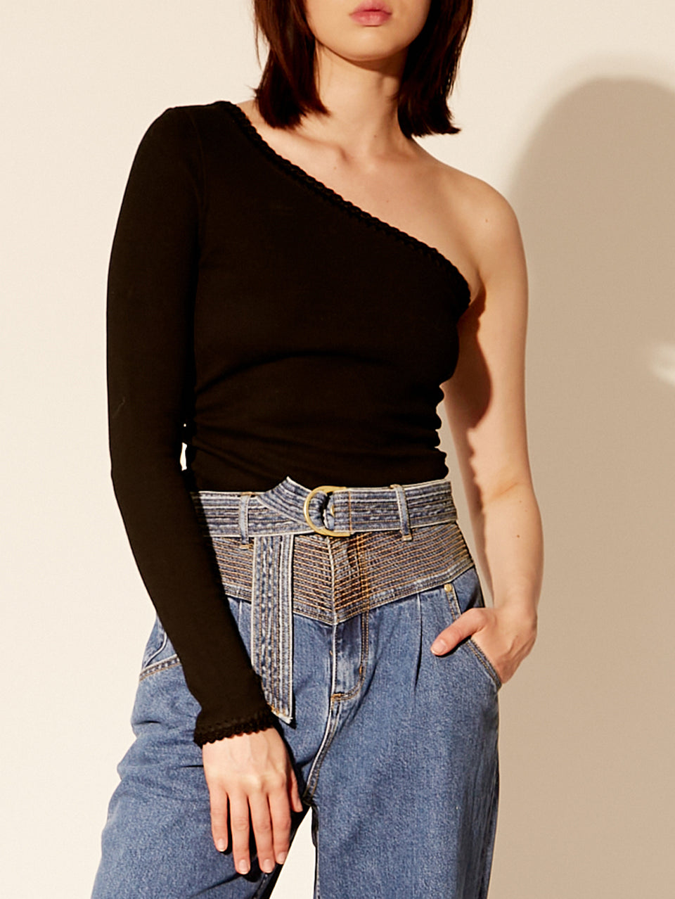 Tallulah One Shoulder Top Black KIVARI | Model wears black one shoulder top close up