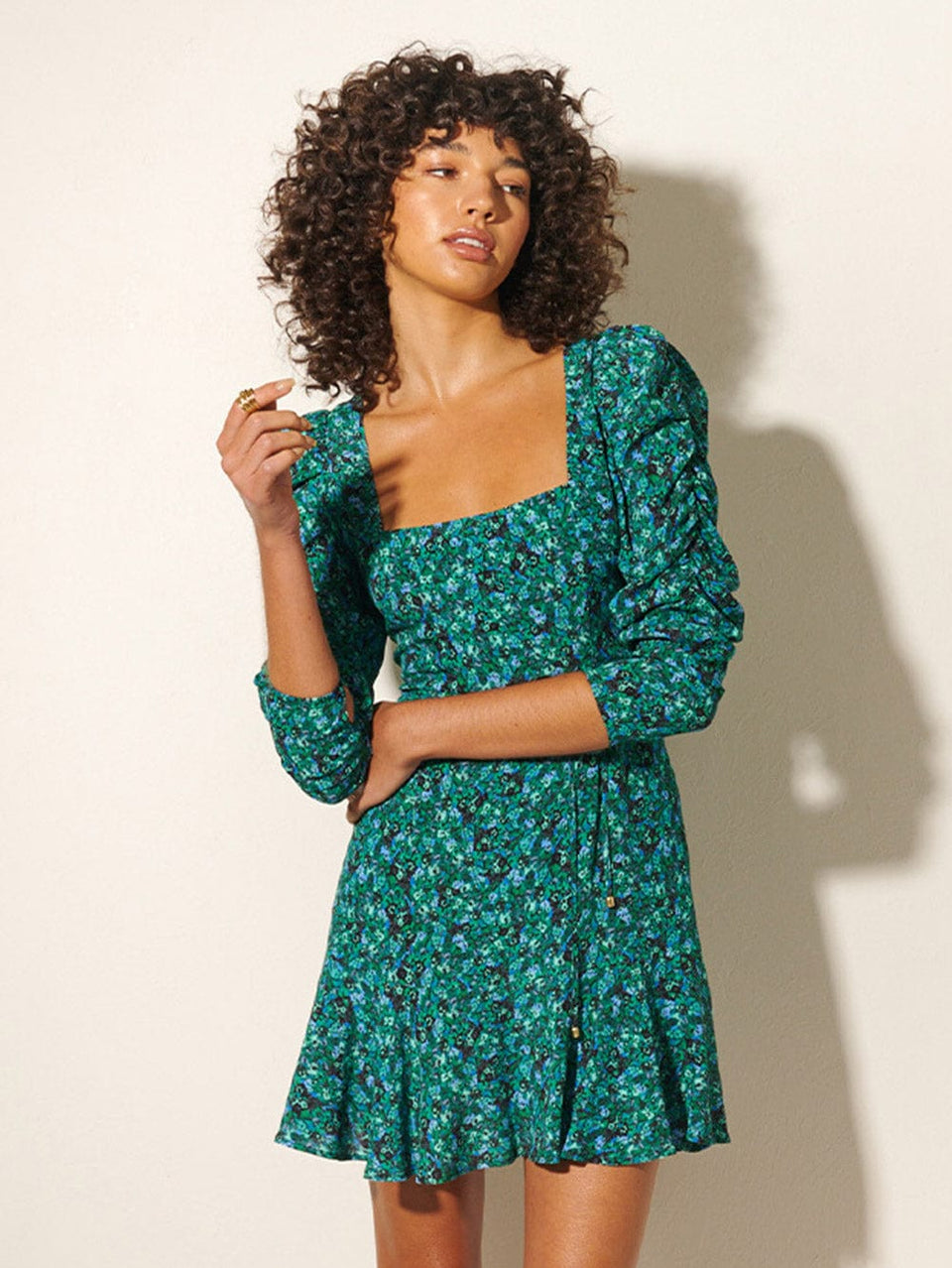 KIVARI Acacia Mini Dress | Model wears Green Floral Mini Dress 
