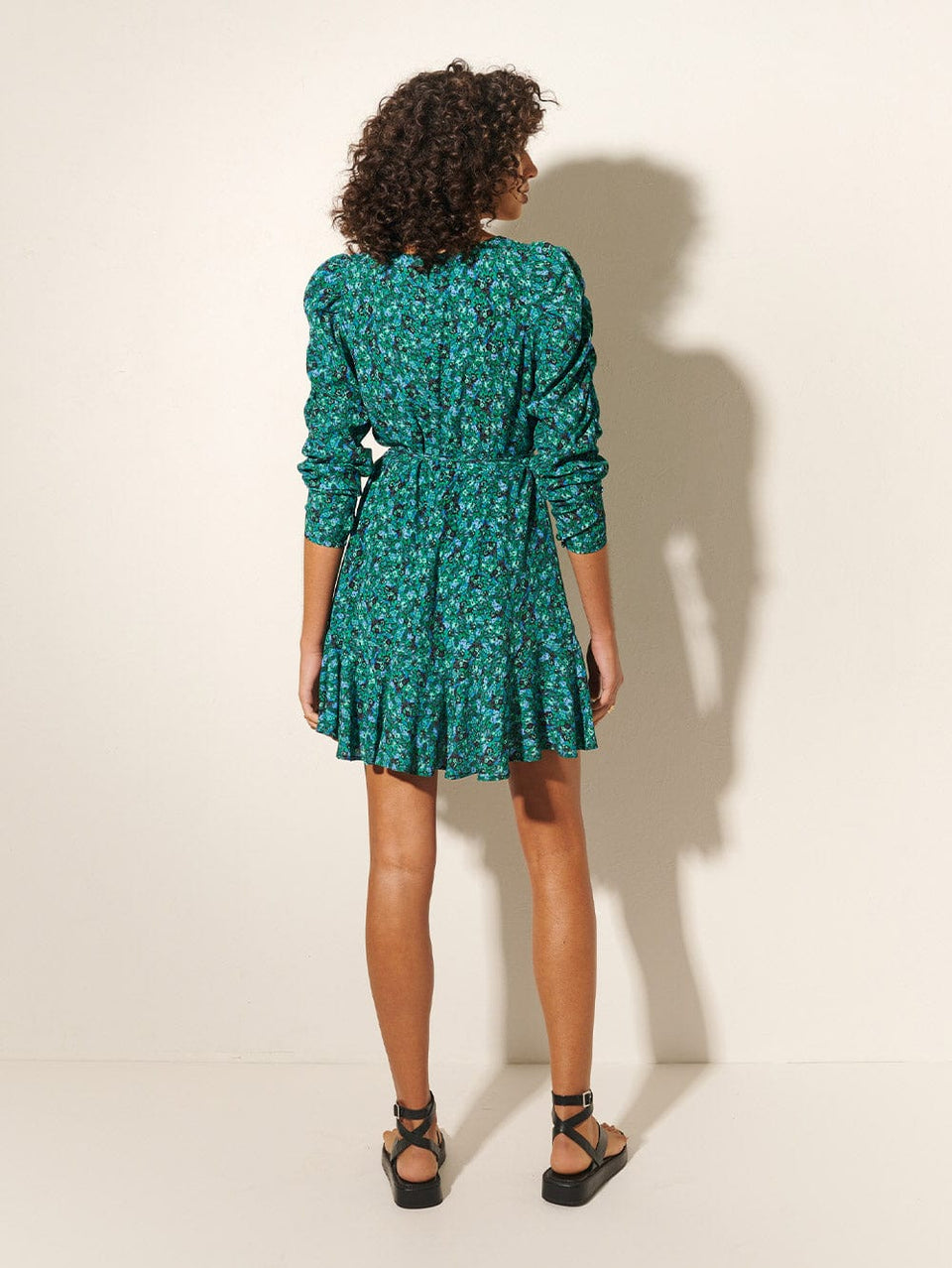 KIVARI Acacia Mini Dress | Model wears Green Floral Mini Dress Back View