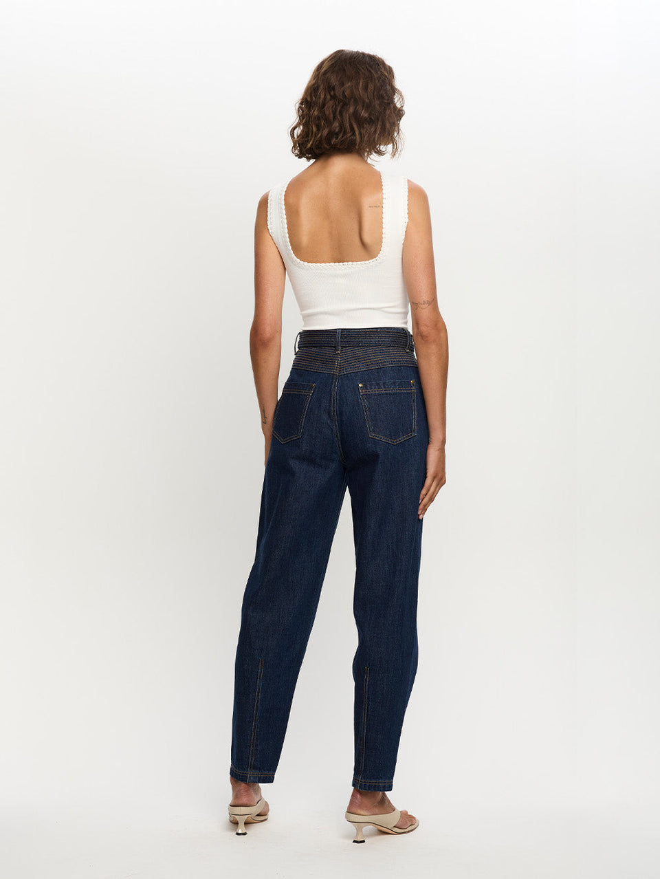 Woman in blue jean with belt 