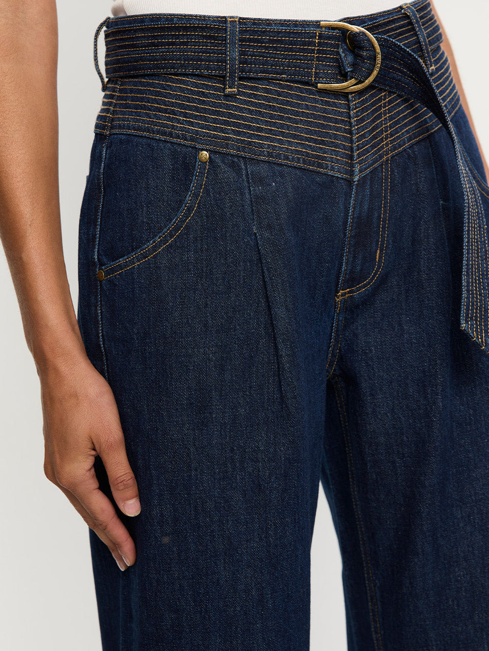 Woman in blue jean with belt 