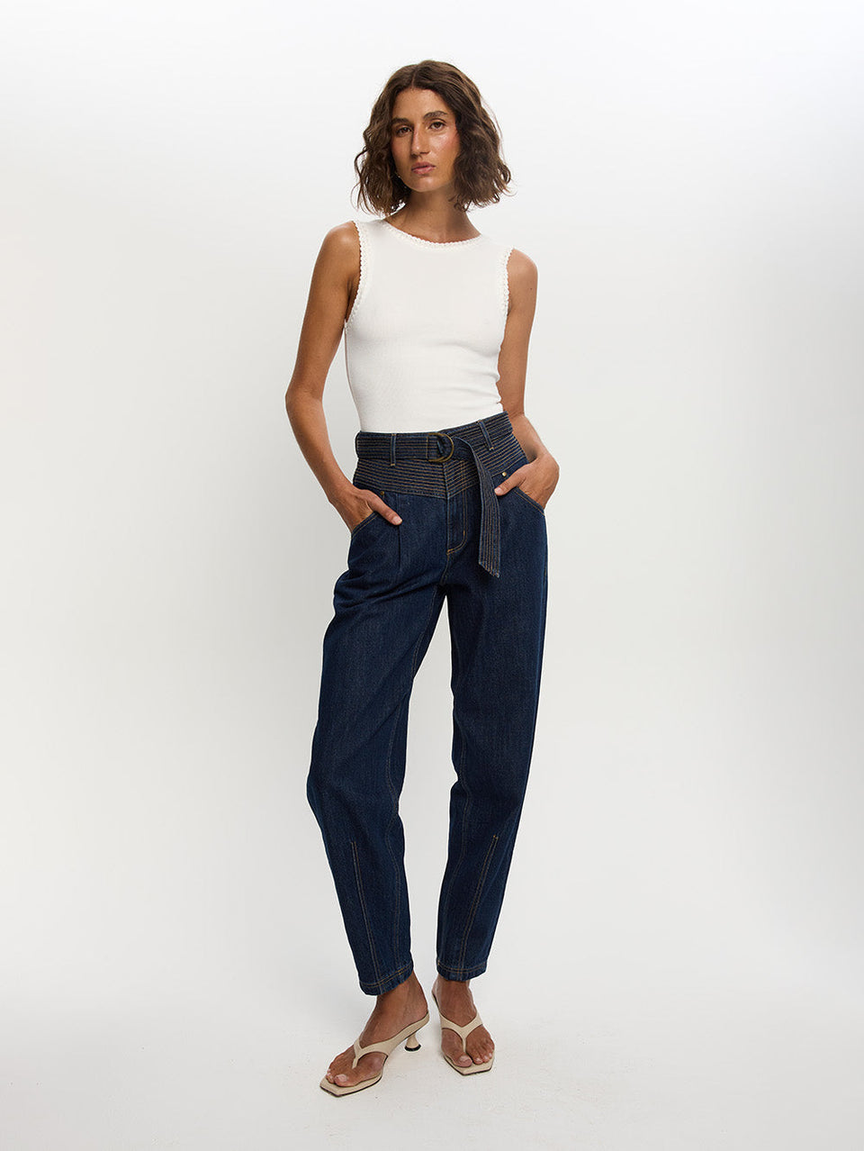 Woman in blue jean with belt 