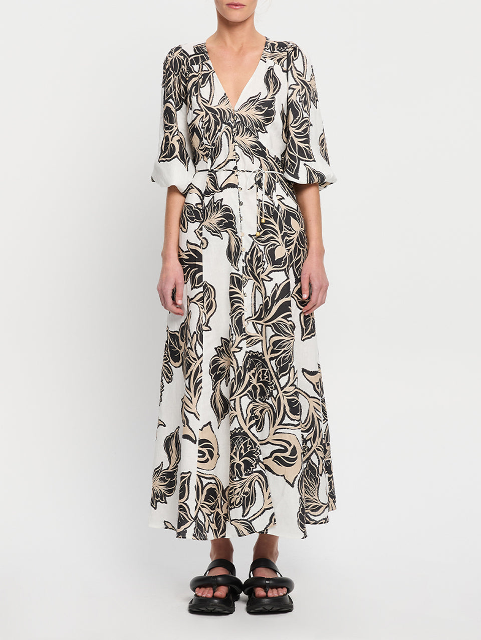 Alma Maxi Dress KIVARI | Model wears black and white floral maxi dress