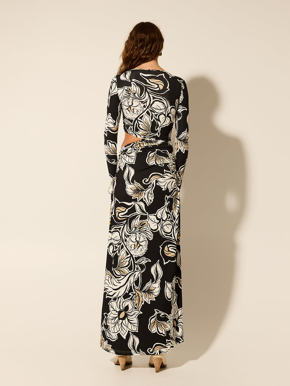 Alma Knit Maxi Dress KIVARI | Model wears black and white floral maxi dress back view