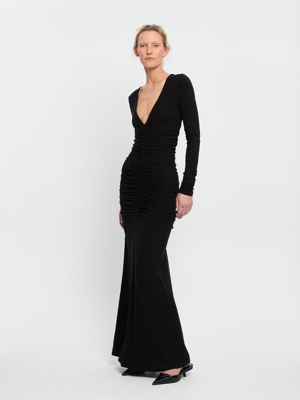 Amal Maxi Dress Black KIVARI | Model wears black maxi dress side view