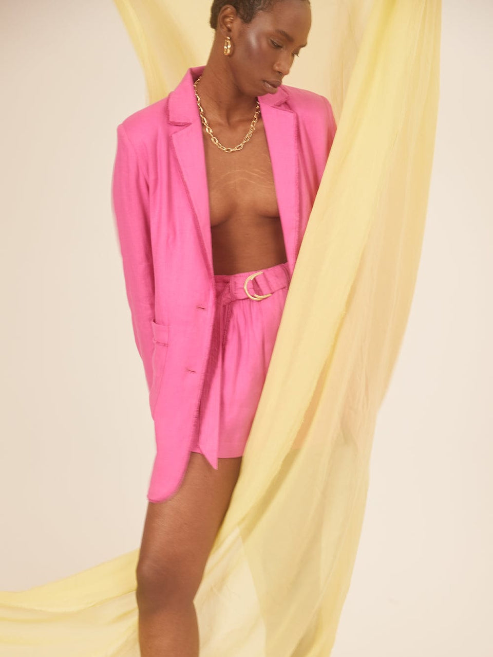 Angelina Short Pink KIVARI | Model wears hot pink short campaign