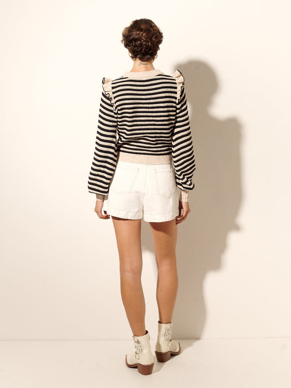 Anita Knit Top KIVARI | Model wears black and white striped knit jumper back view