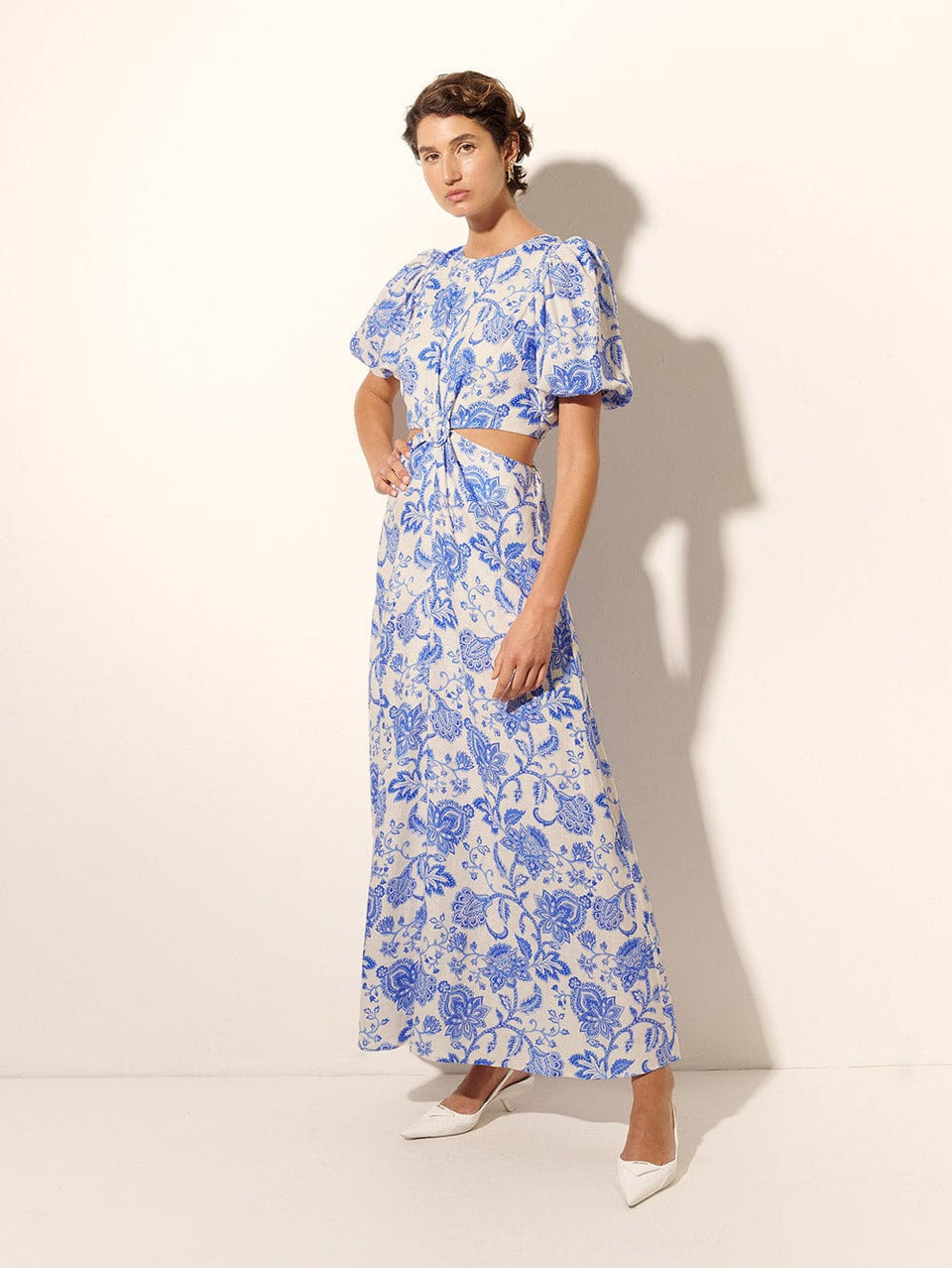 Athena Maxi Dress KIVARI | Model wears blue and white paisley maxi dress side view