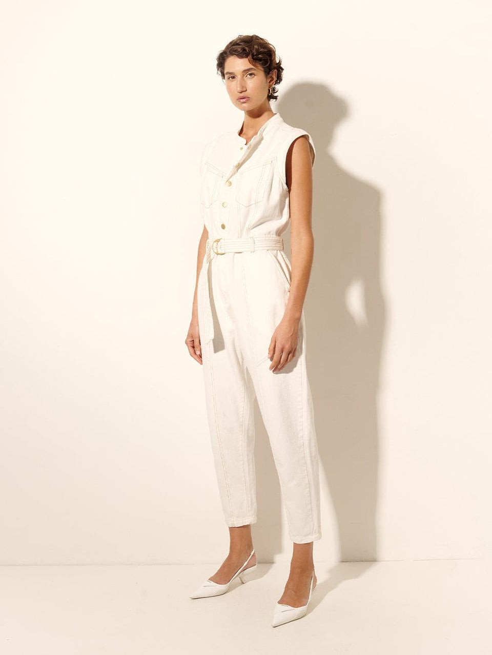 Azalia Denim Boilersuit KIVARI | Model wears cream denim boilersuit side view