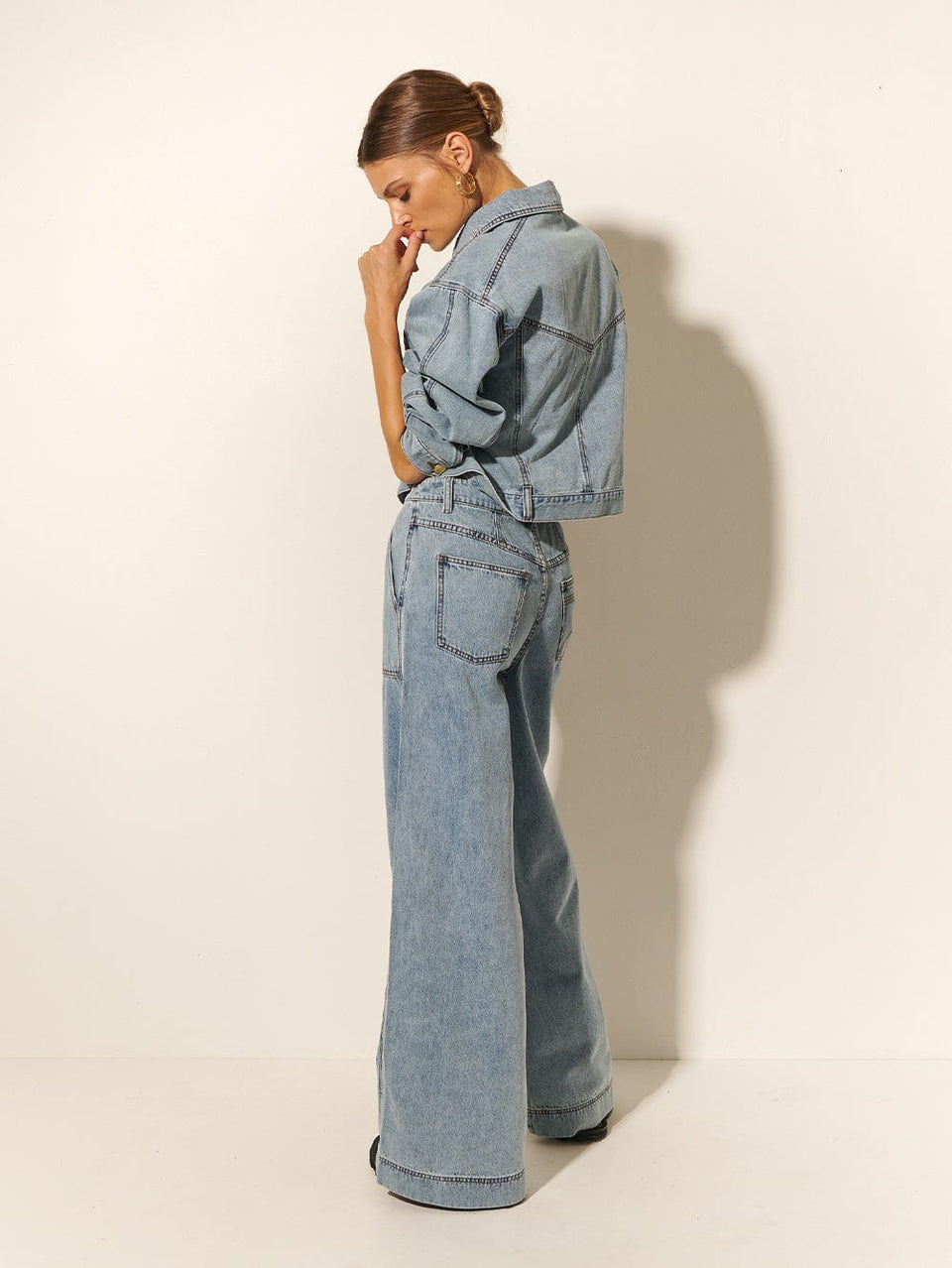KIVARI Azalia High Waisted Jean | Model wearing Blue Denim High Waisted Jeans Back View