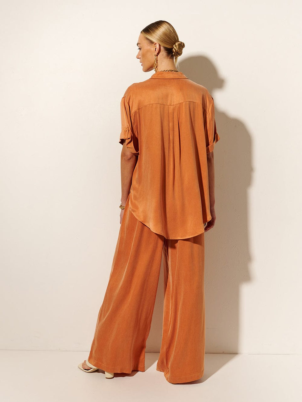 KIVARI Bianca Pant | Model wears Orange Pant Back View