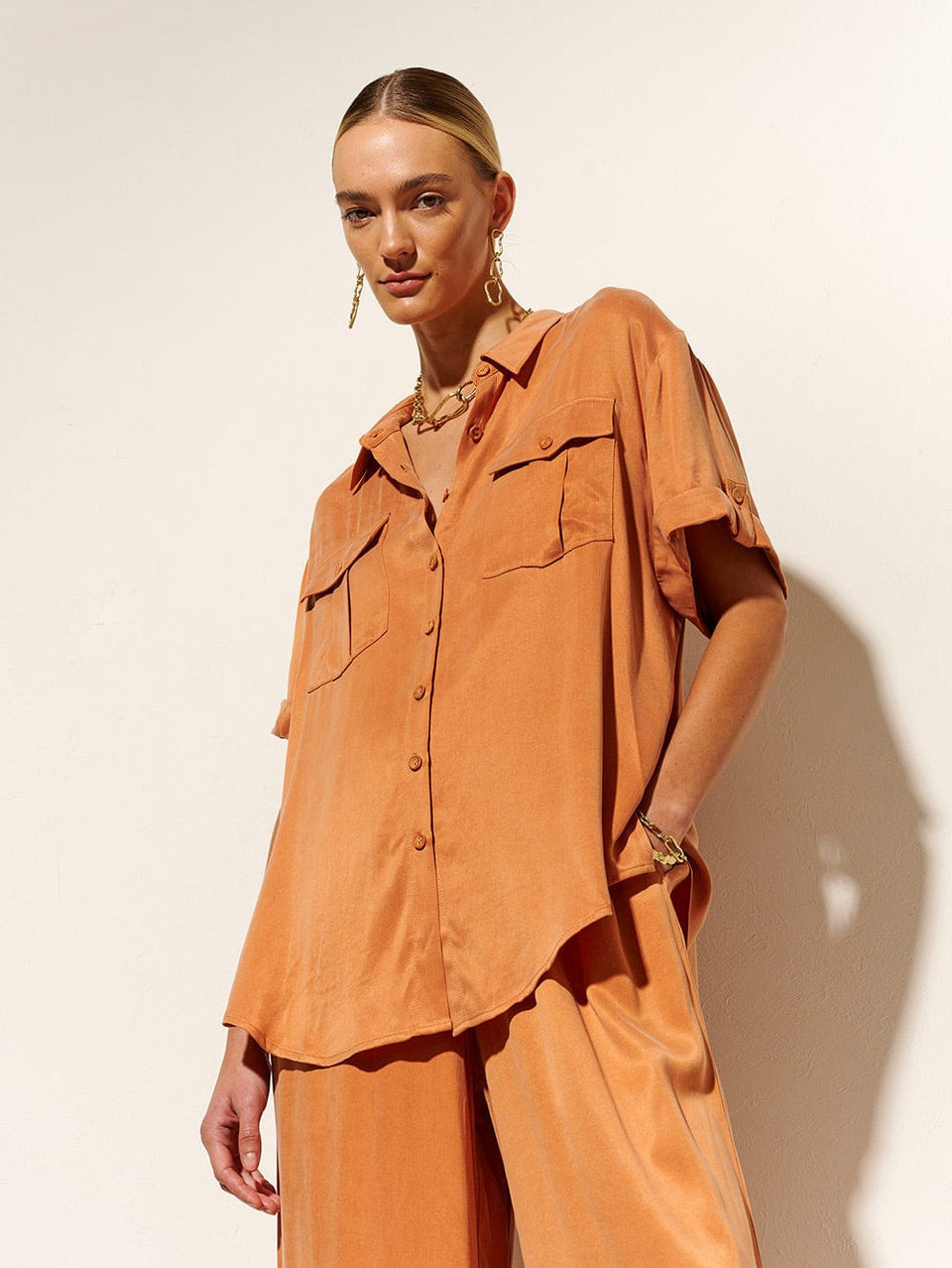KIVARI Bianca Shirt | Model wears Orange Shirt Close Up