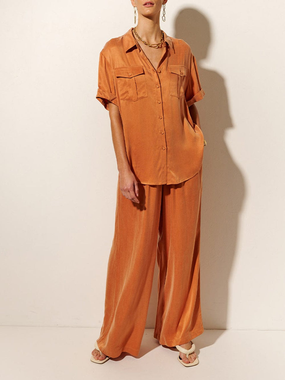 KIVARI Bianca Shirt | Model wears Orange Shirt