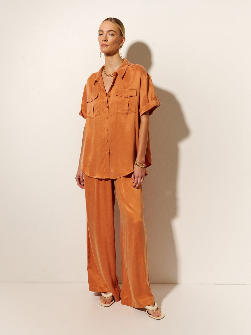 KIVARI Bianca Shirt | Model wears Orange Shirt