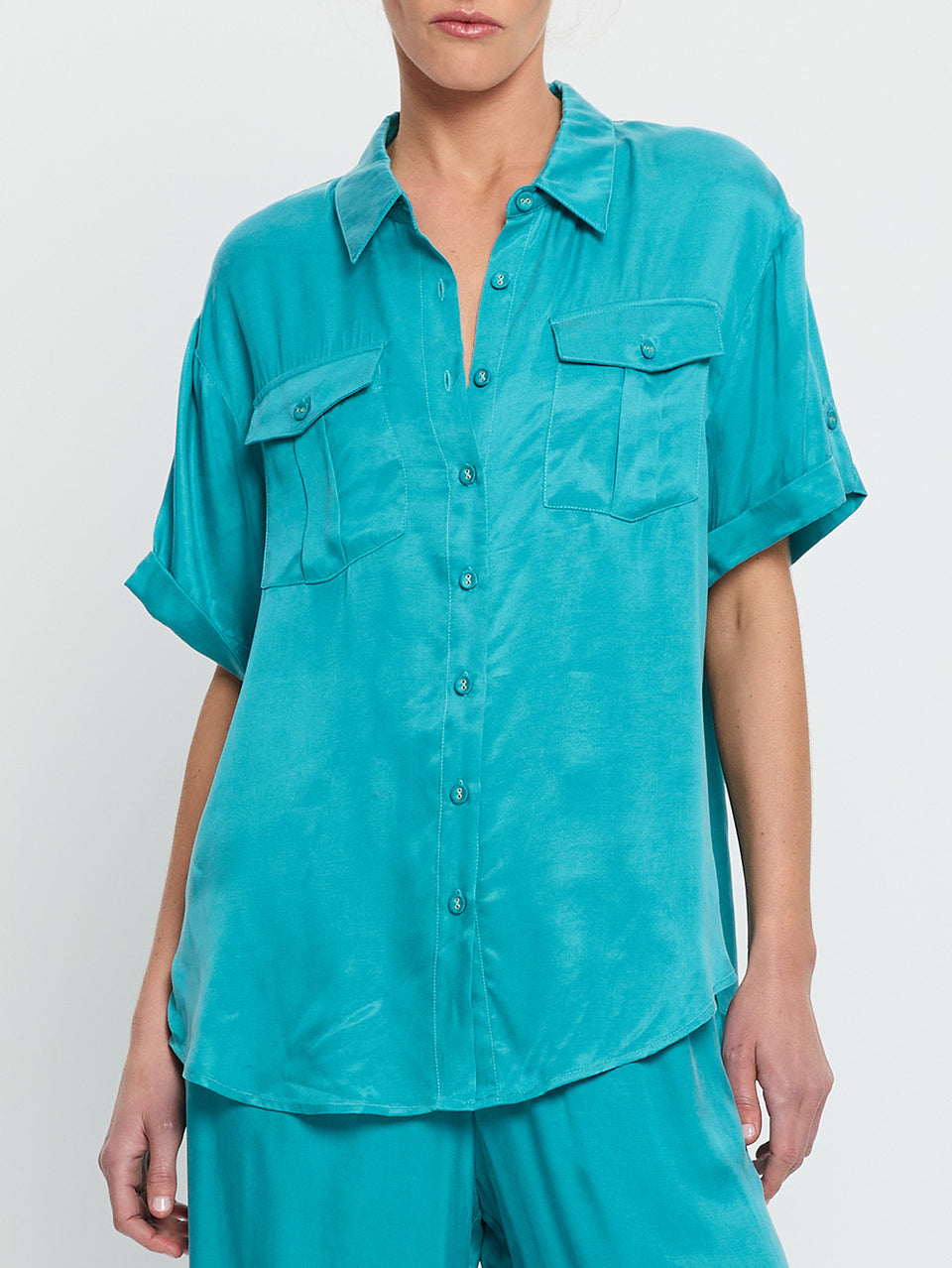 Bianca Shirt Teal KIVARI | Model wears teal shirt detail