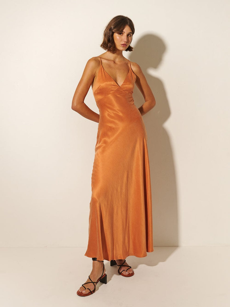 KIVARI Bianca Slip Maxi Dress | Model wears Orange Slip Maxi Dress