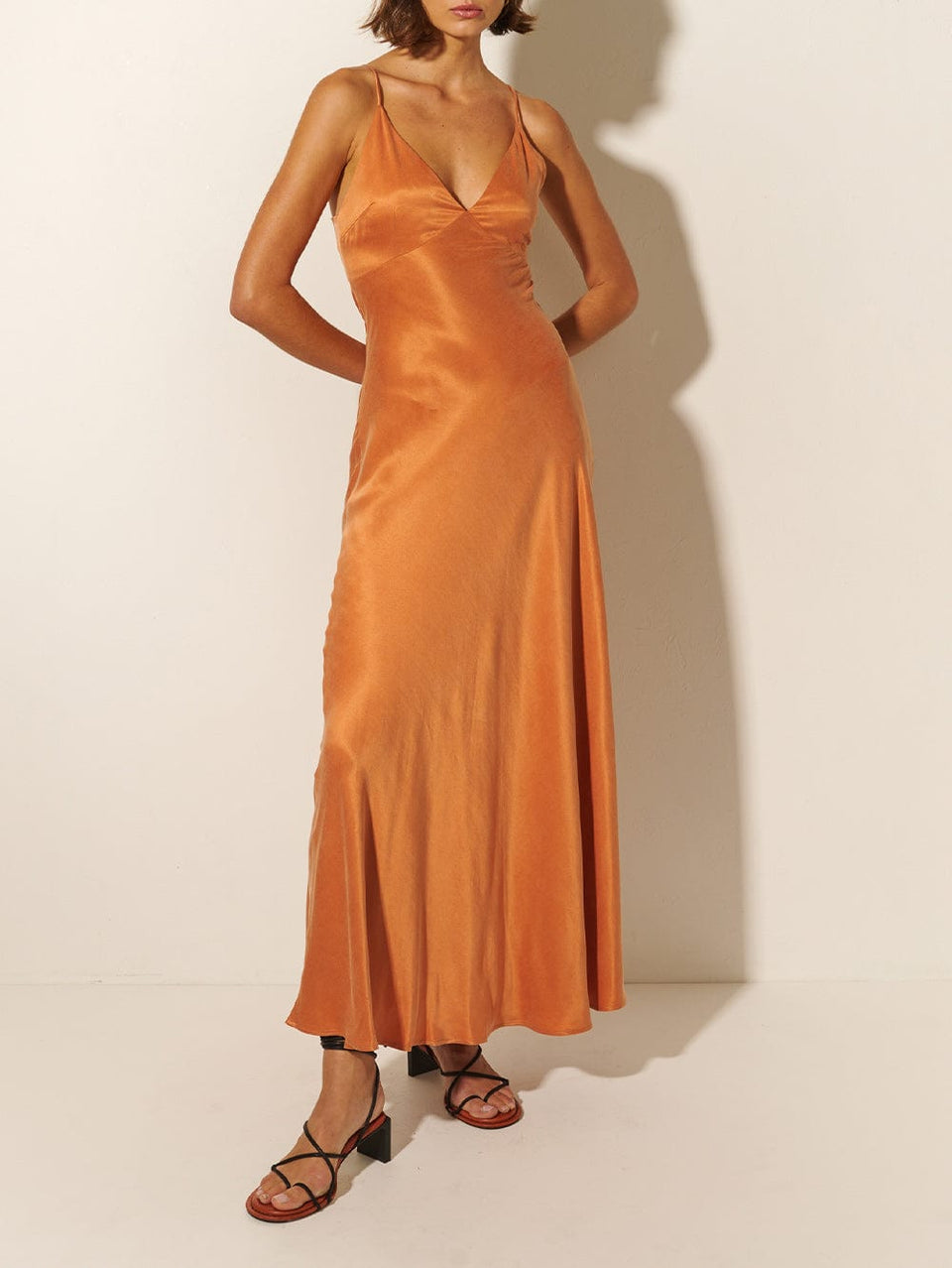 KIVARI Bianca Slip Maxi Dress | Model wears Orange Slip Maxi Dress