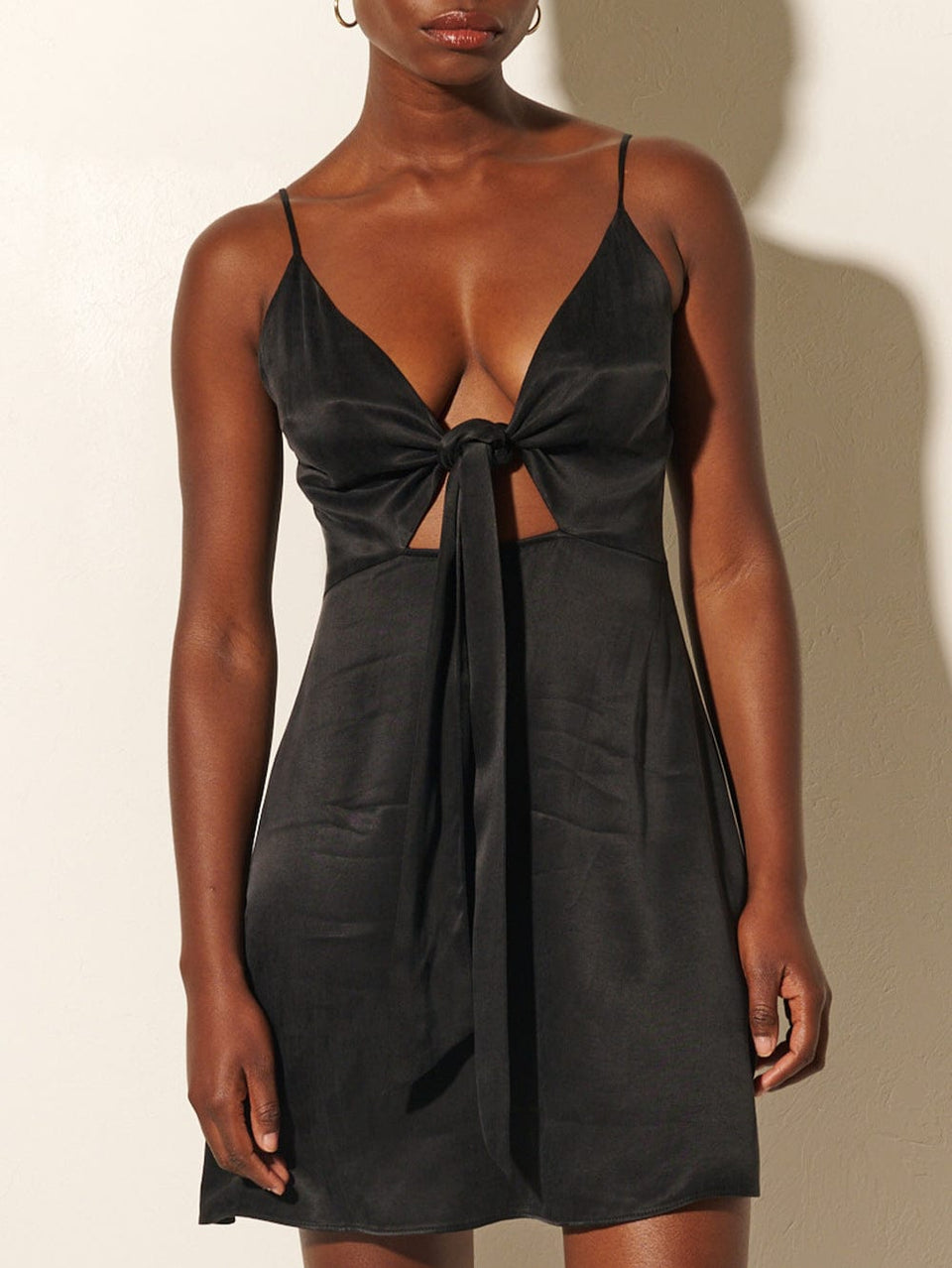 KIVARI Bianca Tie Front Mini Dress | Model wears Black Tie Front Mini Dress Close Up