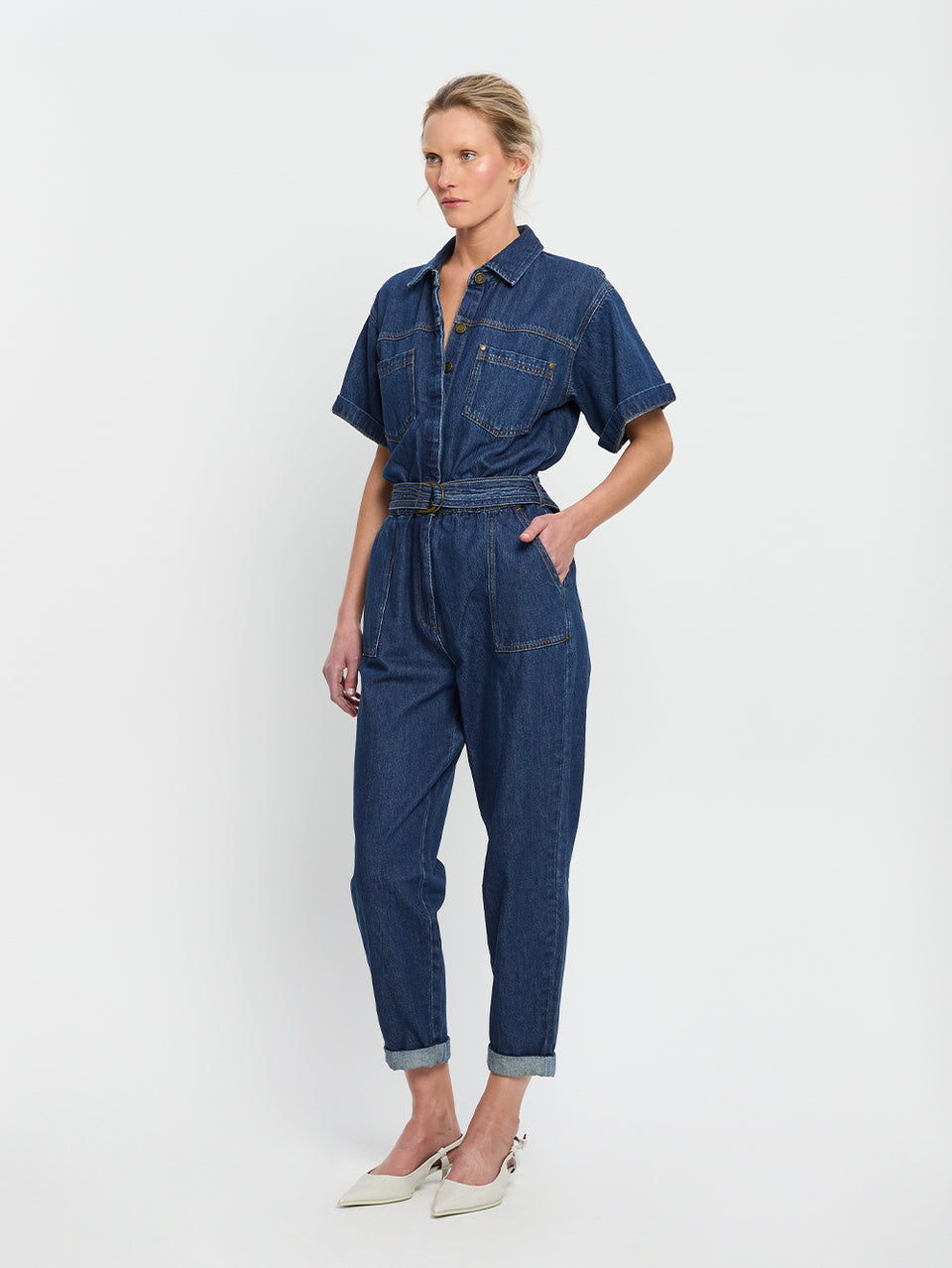 Brae Boilersuit Indigo KIVARI | Model wears indigo blue denim boilersuit side view