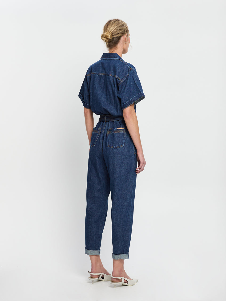 Brae Boilersuit Indigo KIVARI | Model wears indigo blue denim boilersuit back view