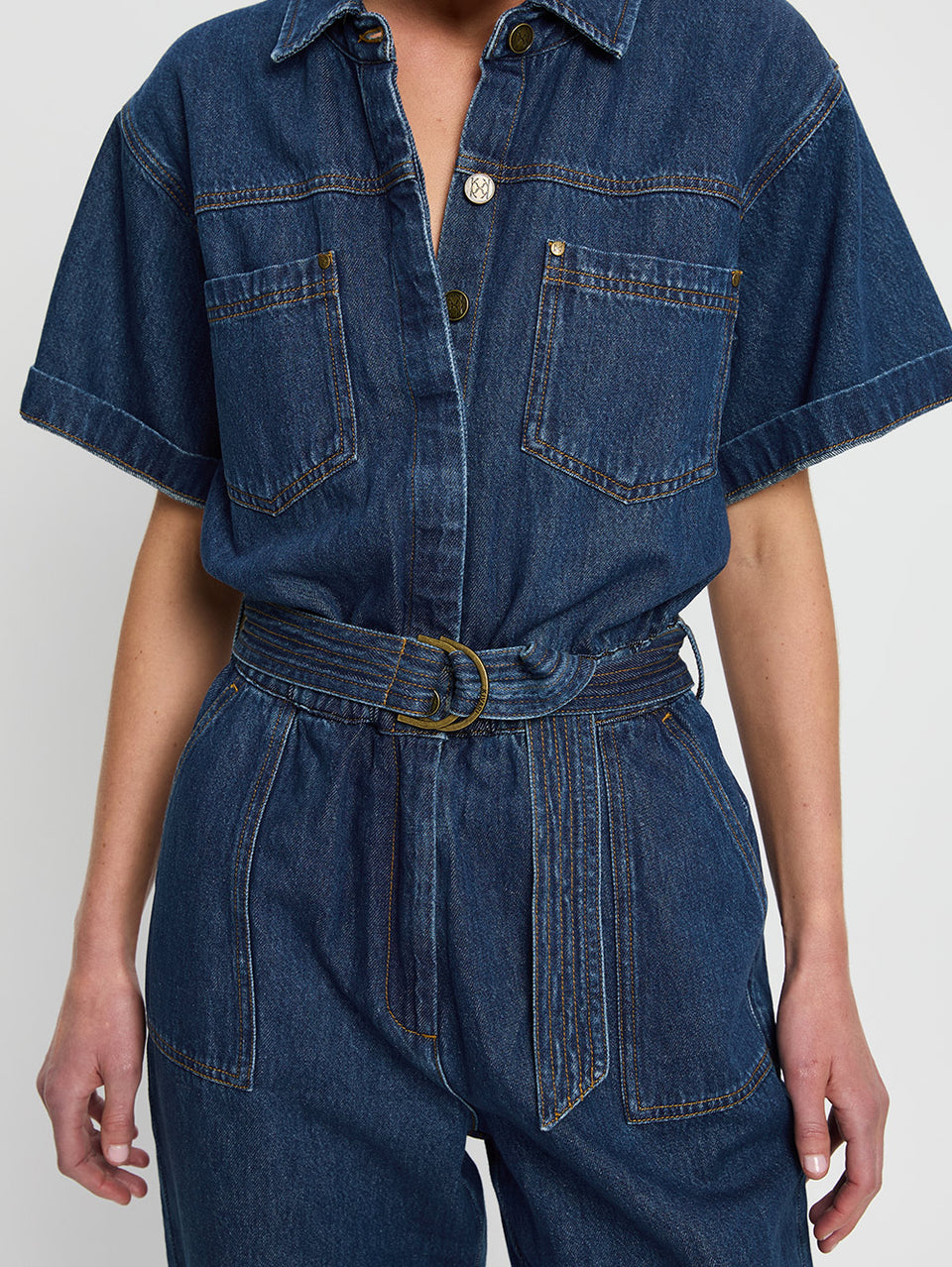 Brae Boilersuit Indigo KIVARI | Model wears indigo blue denim boilersuit close up