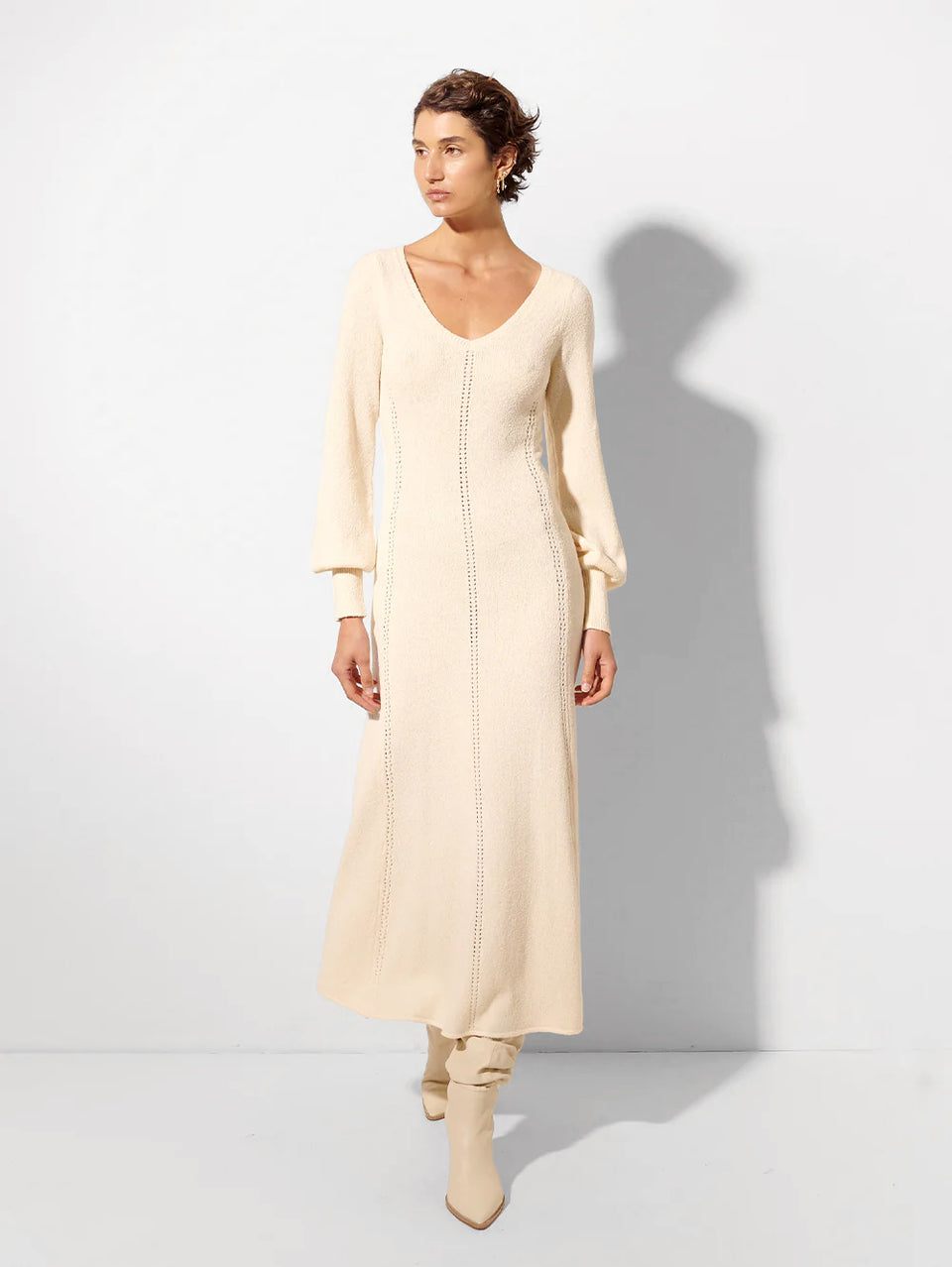 kivari knit dress Radiating sophistication in the Rafaela Knit Dress from Kivari, Eva stuns in this timeless beauty, perfect for everything from sunlit strolls to evening soires. The Kivari Rafaela dress is all about