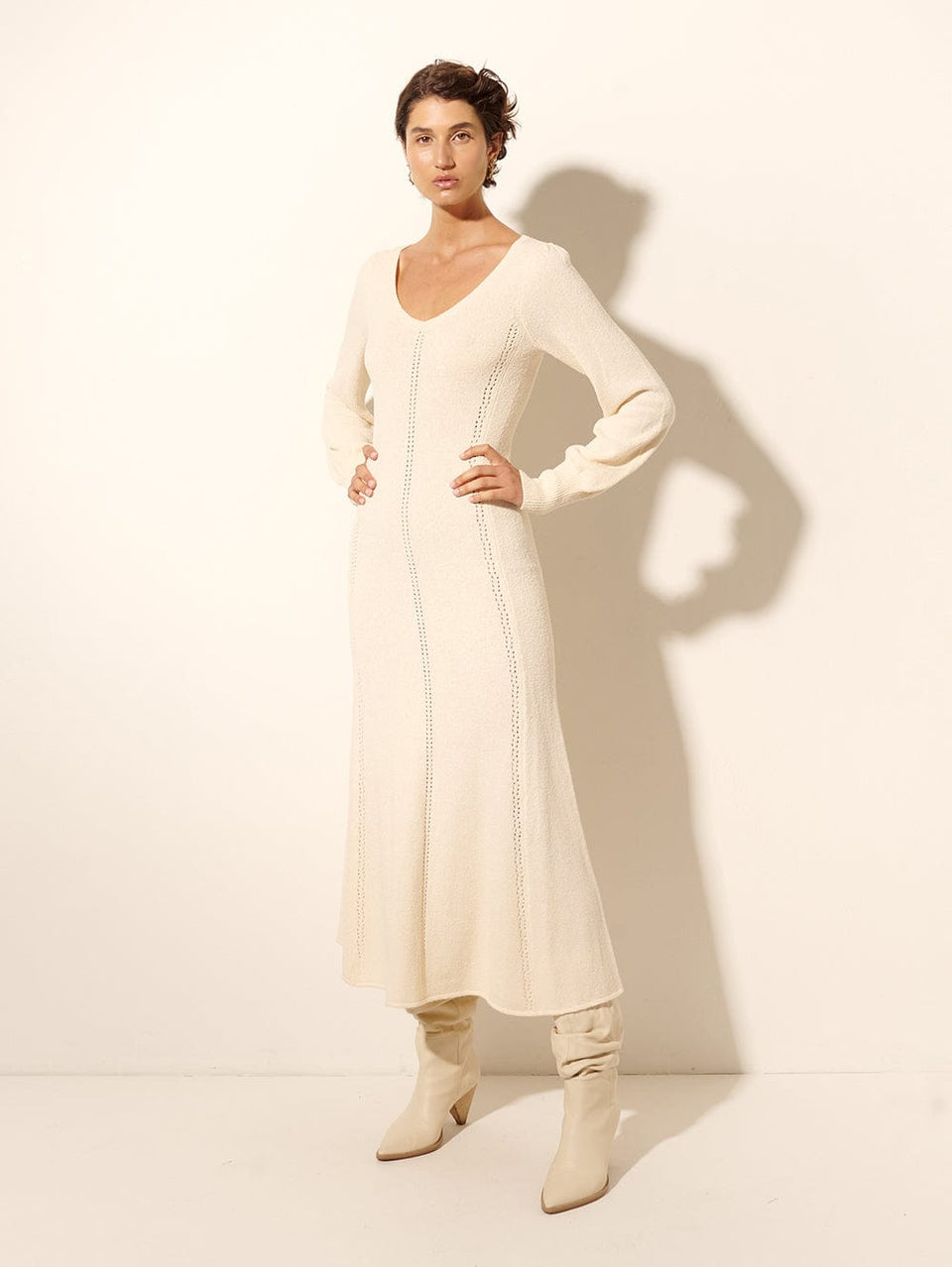 Cali Knit Dress KIVARI | Model wears cream knit midi dress side view