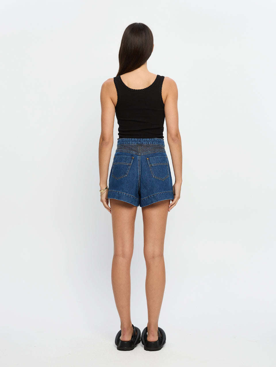 Celene Denim Short Indigo | Model wears blue denim short back view