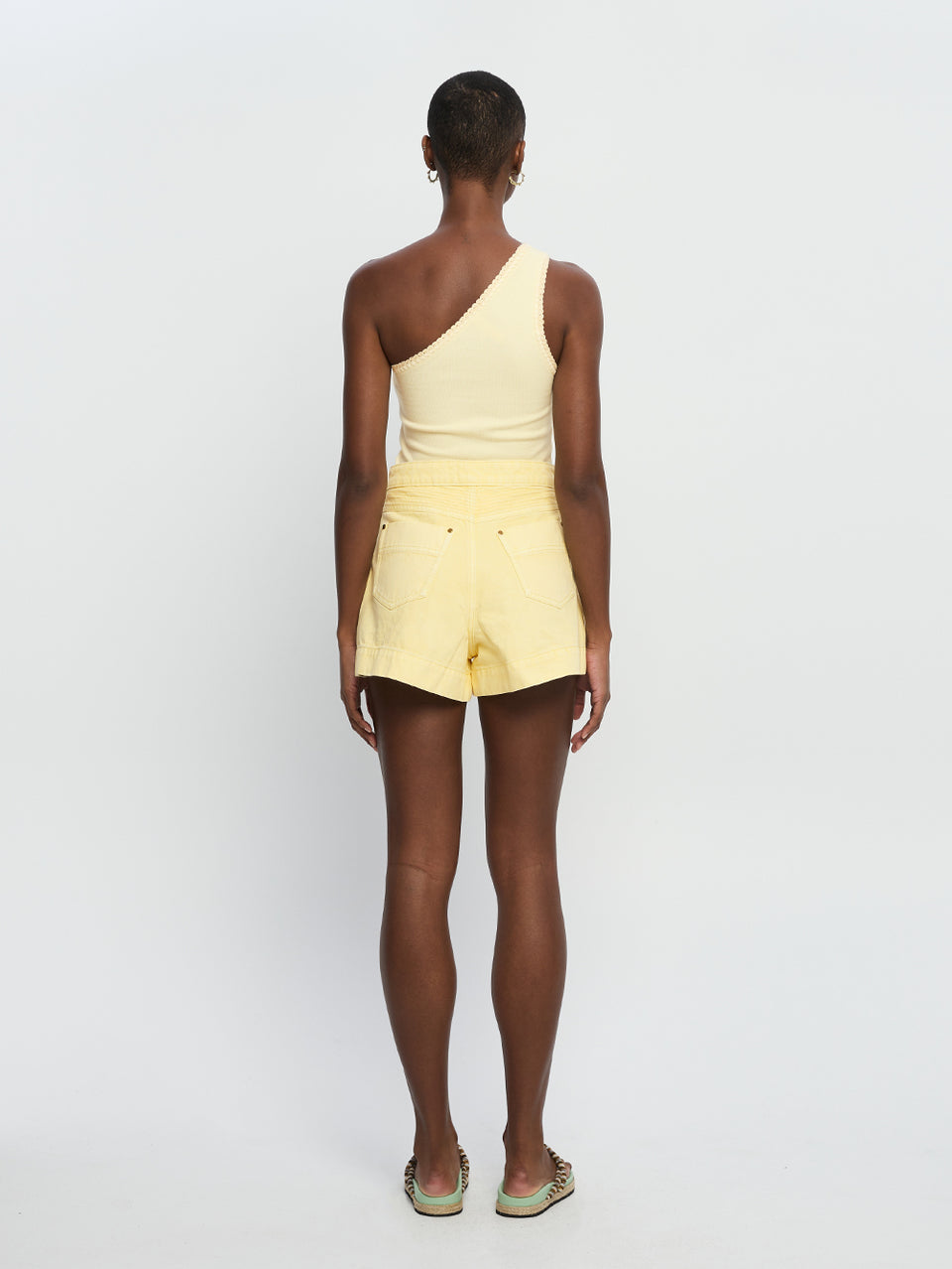 Celene Short Butter KIVARI | Model wears yellow denim shorts back view